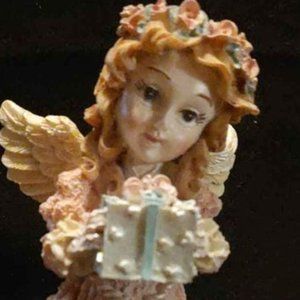1995 House of Lloyd Pink Christmas Angel Holding Gift on a Wooden Base